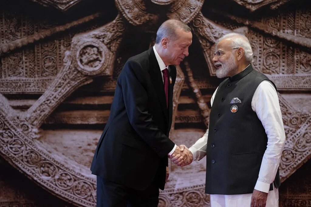 India's Prime Minister Narendra Modi shakes hands with Turkey's President Recep Tayyip Erdogan ahead of the G20 Leaders' Summit in New Delhi on 9 September 2023