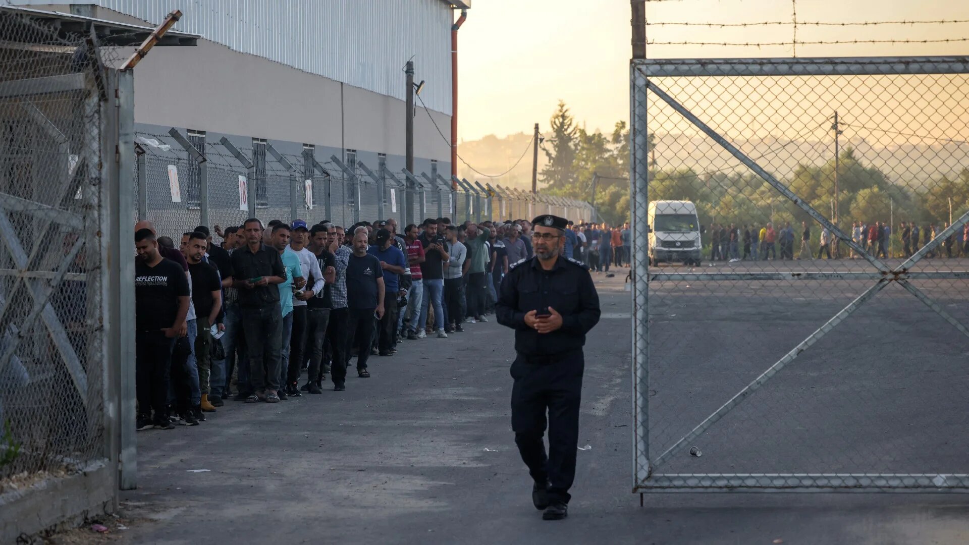 Palestinian workers gather at the Erez crossing between Israel and the northern Gaza Strip, on 28 September 2023 (AFP/Mohammed Abed)