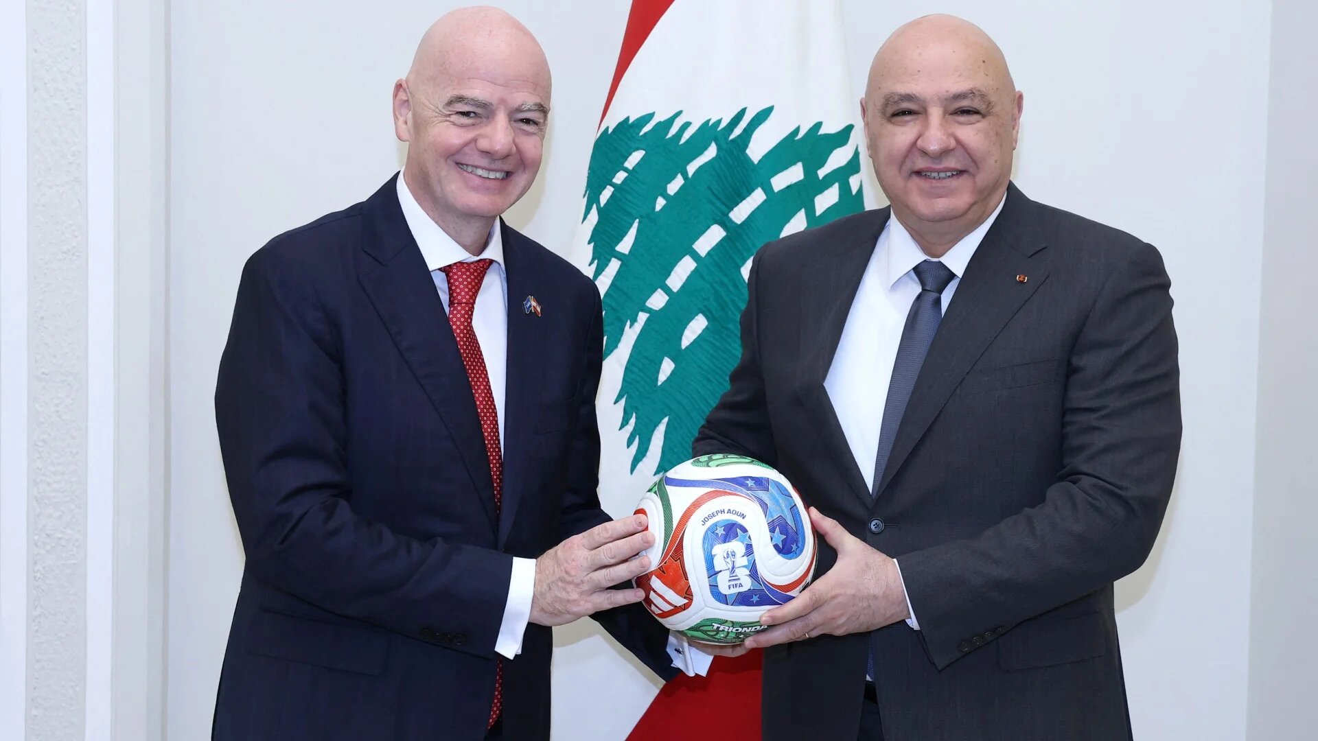 A handout photograph released by the Lebanese Presidency's press office shows Fifa president Gianni Infantino posing with Lebanese President Joseph Aoun (R) at the presidential palace of Baabda, east of Beirut, on 25 November 2025 (Handout/Lebanese presidency/AFP)