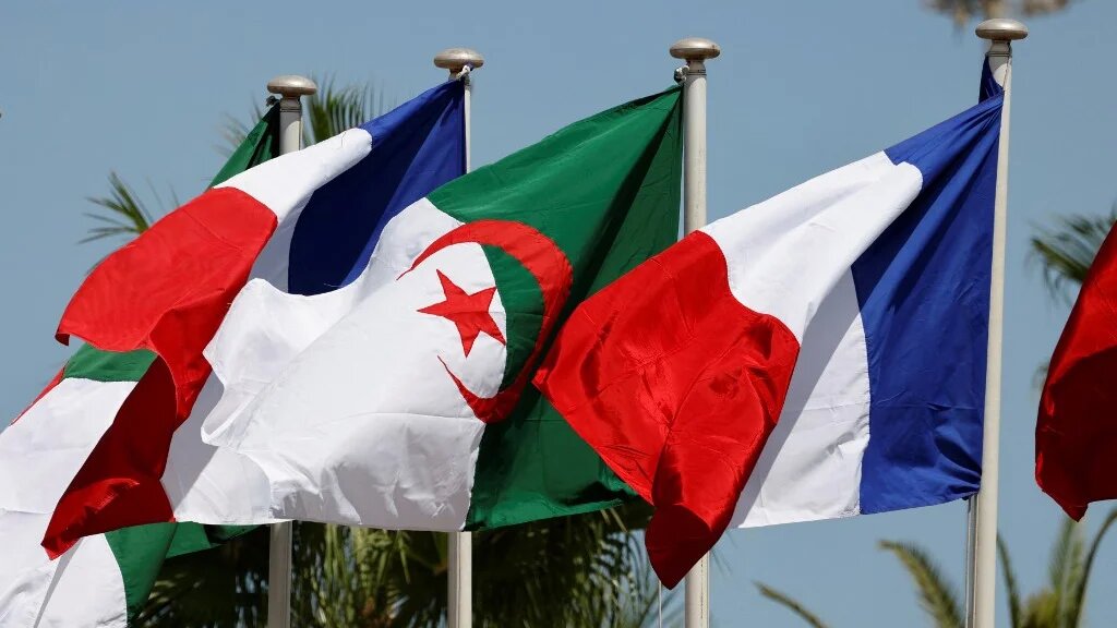 French and Algerian flags fly in Algiers on 25 August 2022 (Ludovic Marin/AFP)
