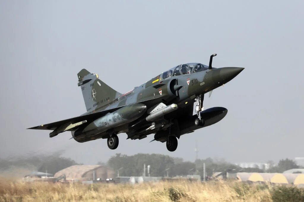 The French military said a fighter jet had struck a jihadist group at a location north of the village, killing several dozen combatants.