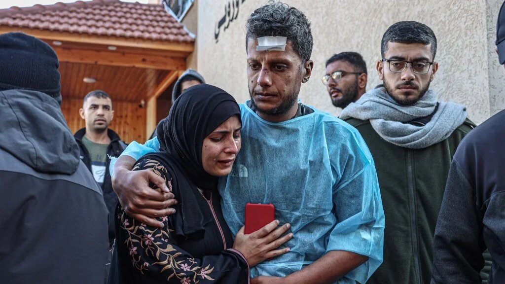 Relatives of Palestinians killed during Israeli bombardment, mourn their loved ones at the European hospital in Khan Yunis in the southern Gaza Strip, on January 6, 2024 AFP