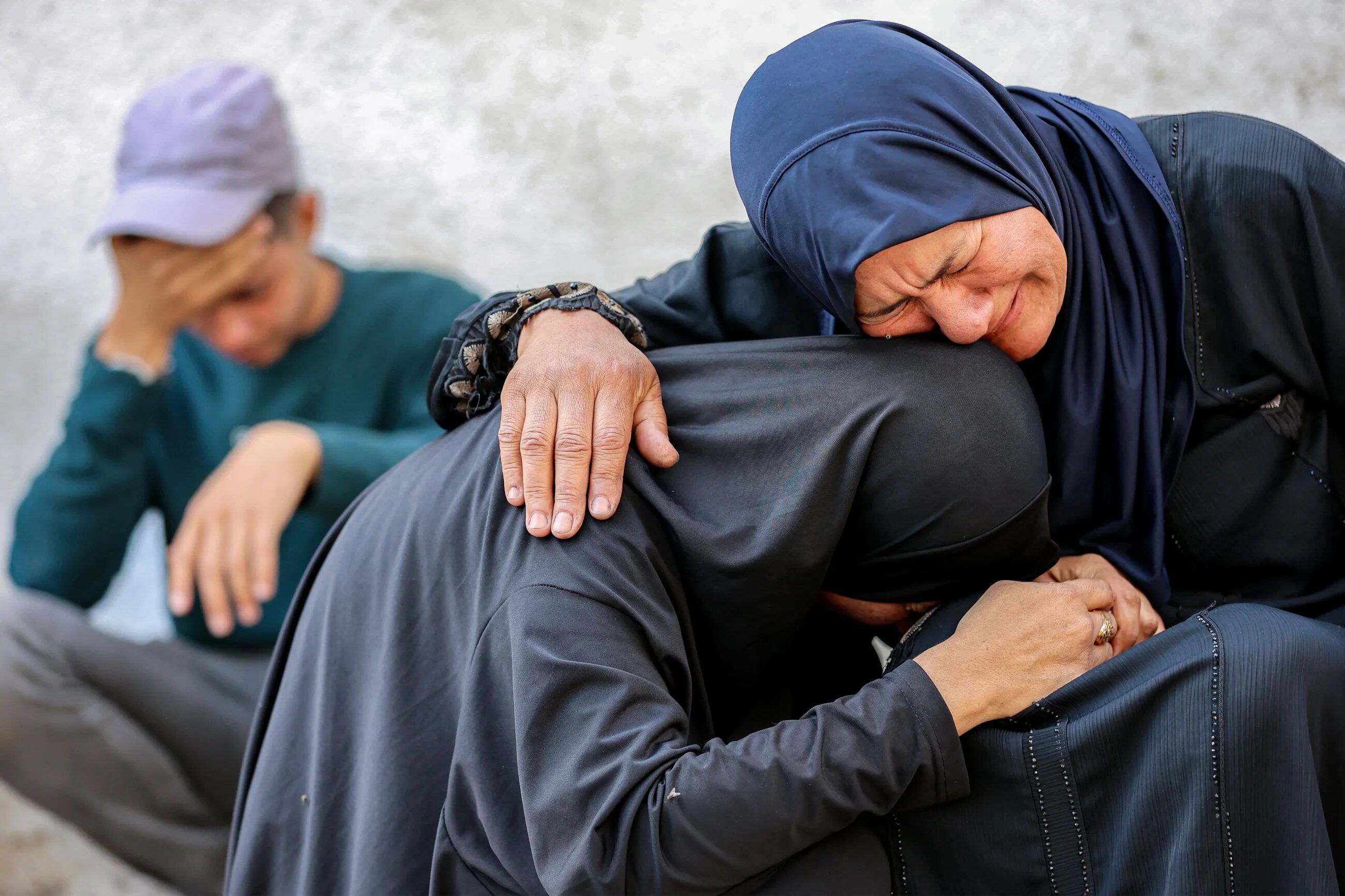 Palestinian women mourn victims killed during overnight Israeli attacks, at al-Shifa hospital in Gaza City on 4 June 2025 (AFP/Omar al-Qattaa)