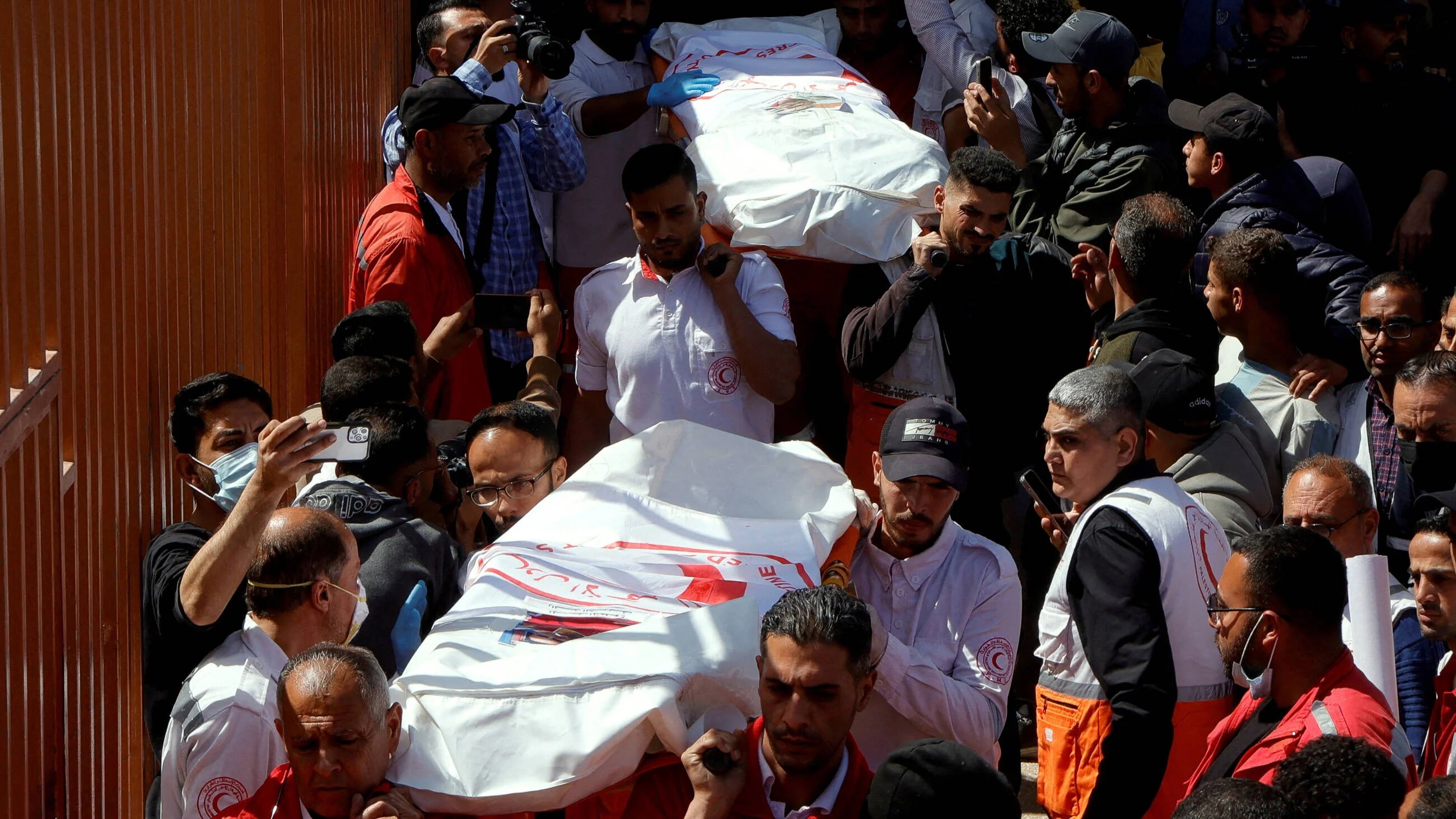 Palestinians mourn medics, who came under Israeli fire while on a rescue mission, at Nasser hospital in Khan Younis in the southern Gaza Strip 31 March 2025 (Reuters)