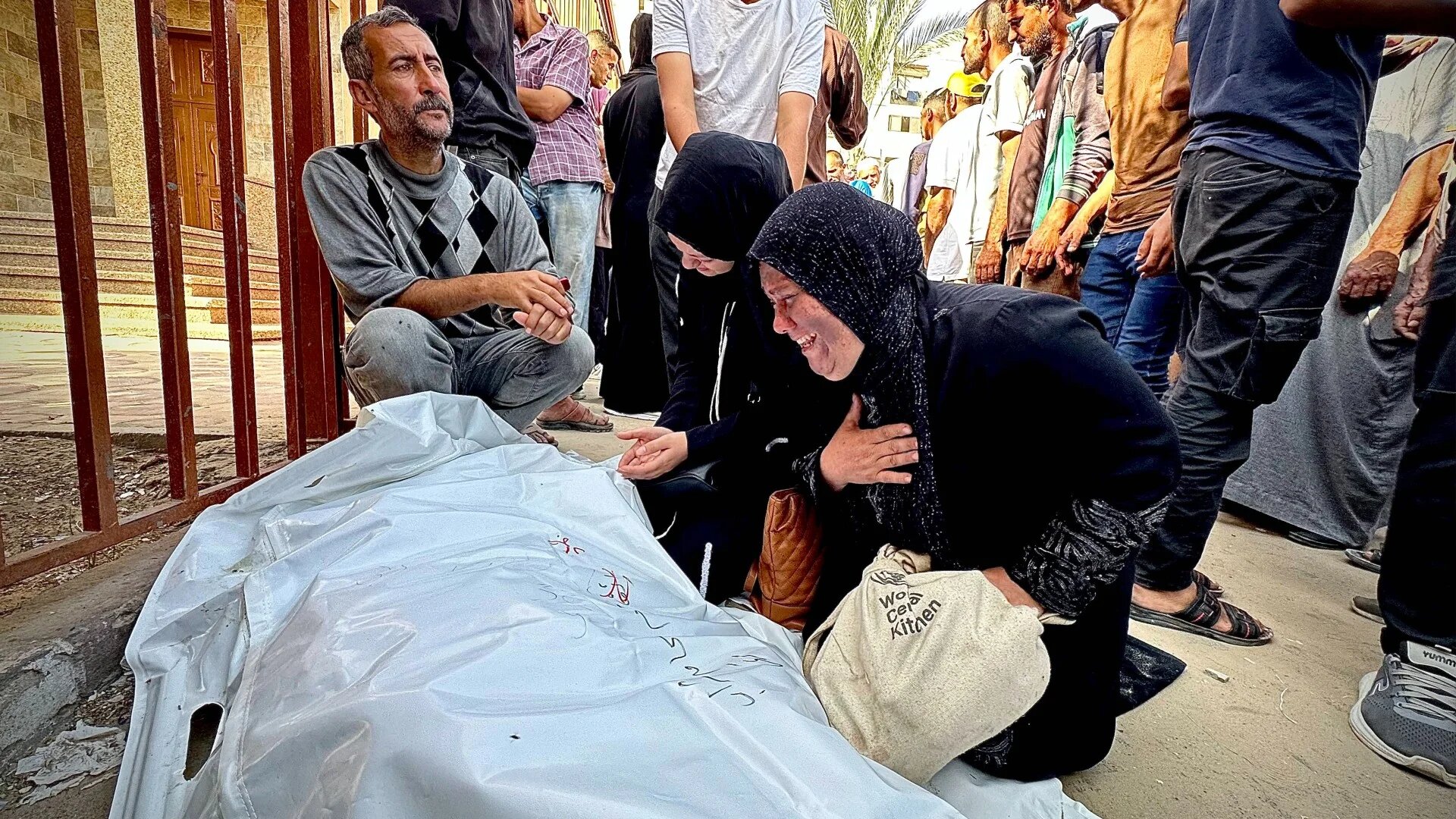 Palestinians mourn their loved ones killed whilst trying to obtain aid food from a Gaza Humanitarian Foundation (GHF) aid hub in Rafah in the southern Gaza Strip, on 1 June 2025 (Moaz Abu Taha/Reuters)