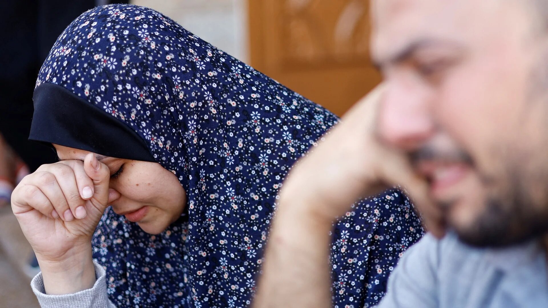 Palestinians are photographed following an Israeli air strike on Khan Younis on 7 November 2023 (Reuters)