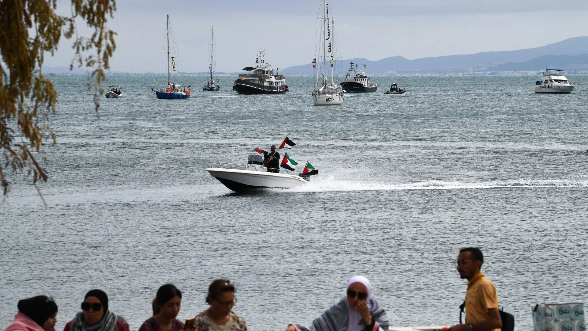 Supporters and activists of the Global Sumud Flotilla gather at the Tunisian port of Sidi Bou Said on 10 September 2025 (AFP/Fethi Belaid) 