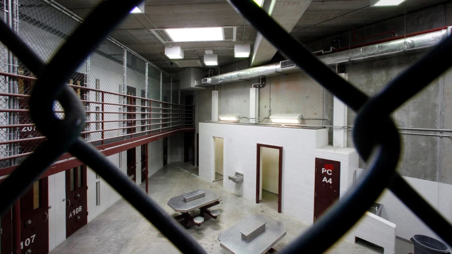 ​​The interior of an unoccupied communal cellblock is seen at Camp VI, a prison used to house detainees at the US Naval Base at Guantanamo Bay, on 5 March 2013