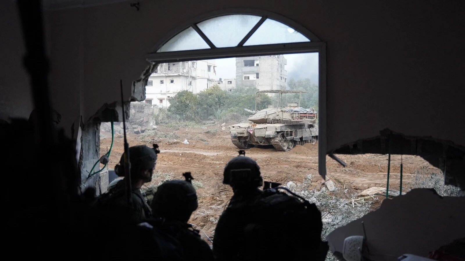 This handout picture released on 18 January 2024 shows Israeli soldiers in Khan Yunis in the southern Gaza Strip (AFP/Handout/Israeli army)