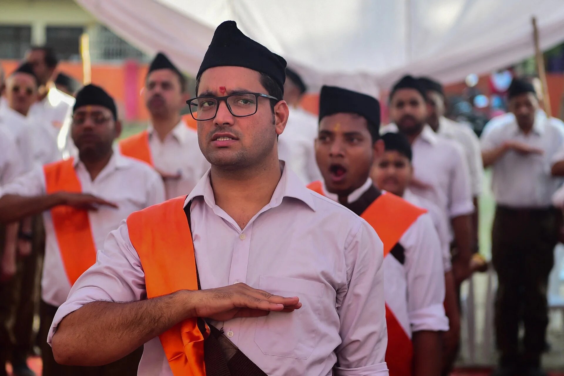 Hindu Rashtriya Swayamsevak Sangh (RSS) volunteers march along a road during an event to mark the Hindu New Year in Allahabad on 2 April 2022 (AFP)