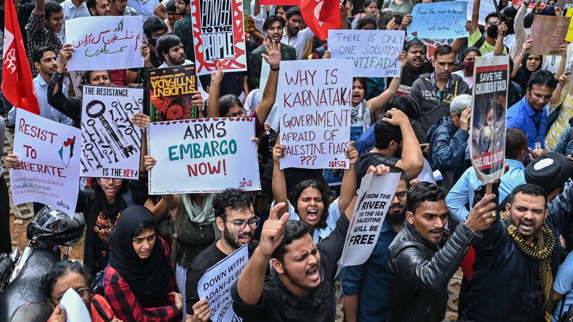 Protesters hold placards as they shout slogans during a demonstration in support of Palestinians in Bengaluru, India on 5 October 2024 (Idrees Mohammed/AFP)