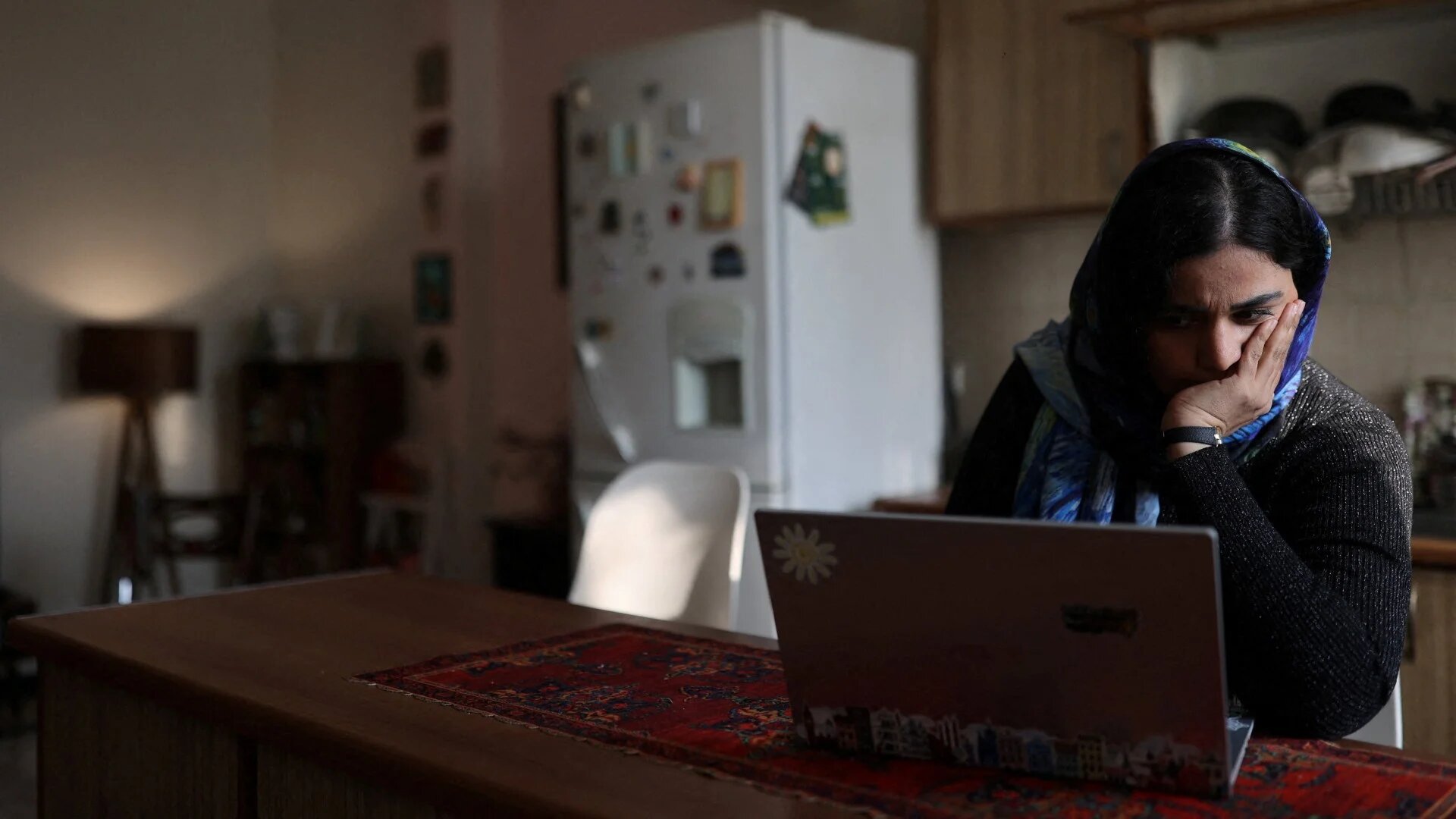 An online teacher works on her laptop at home, after a nationwide internet shutdown in Tehran, Iran, 24 January 2026 (Majid Asgaripour/WANA via Reuters)