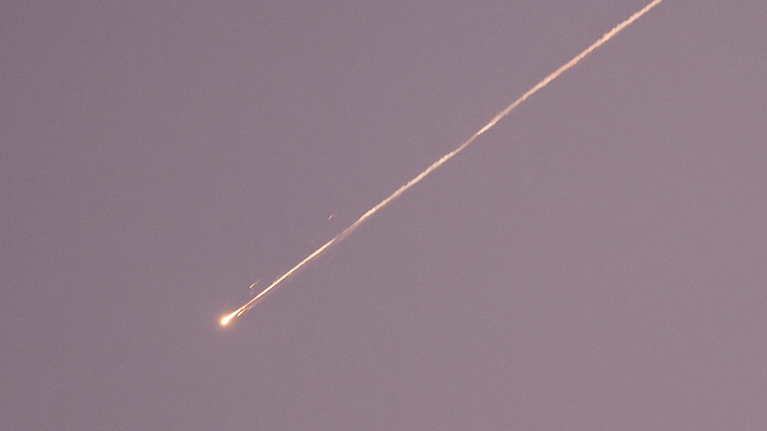 A missile launched from Iran towards Israel is seen from Tubas in the occupied West Bank, 24 June 2025 (Reuters/Raneen Sawafta)