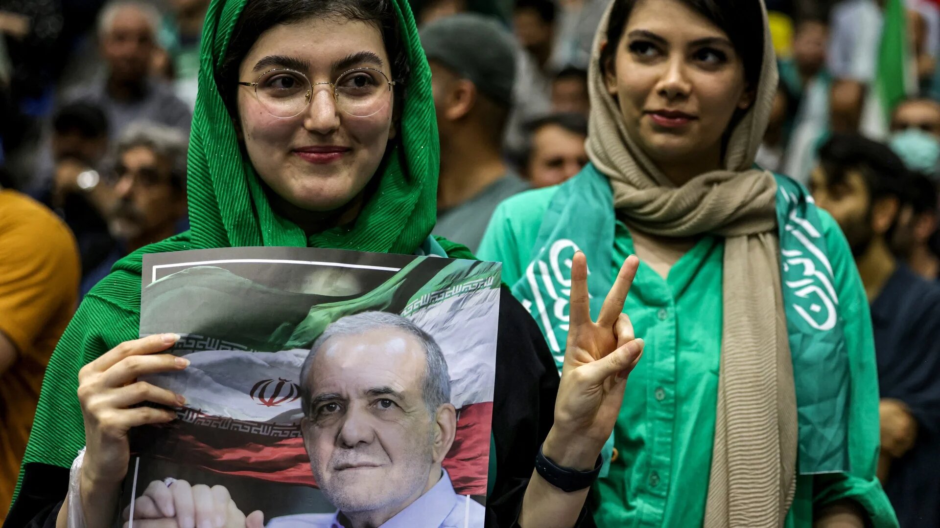 Women attend a campaign rally for reformist candidate Massoud Pezeshkian at Afrasiabi Stadium in Tehran on 23 June (Atta Kenare/AFP)