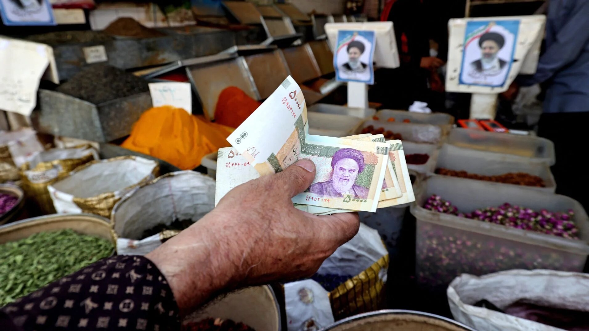 Iranians shop at the Molavi bazaar in southern Tehran on 20 June 2021.