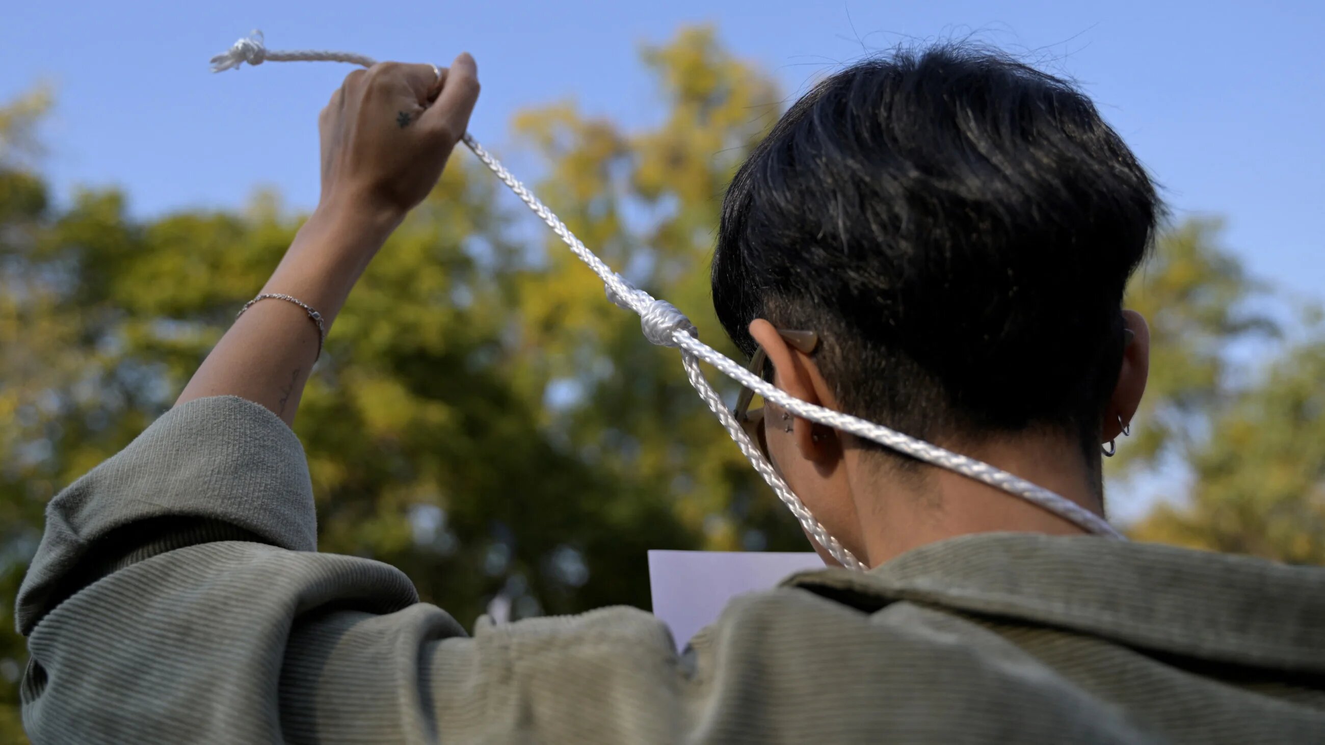 People take part in a protest against the execution of Iranian footballer Amir Nasr-Azadani and to demand human righst in Iran, in front of the Iranian embassy in Mexico City on 19 December 2022 (AFP)