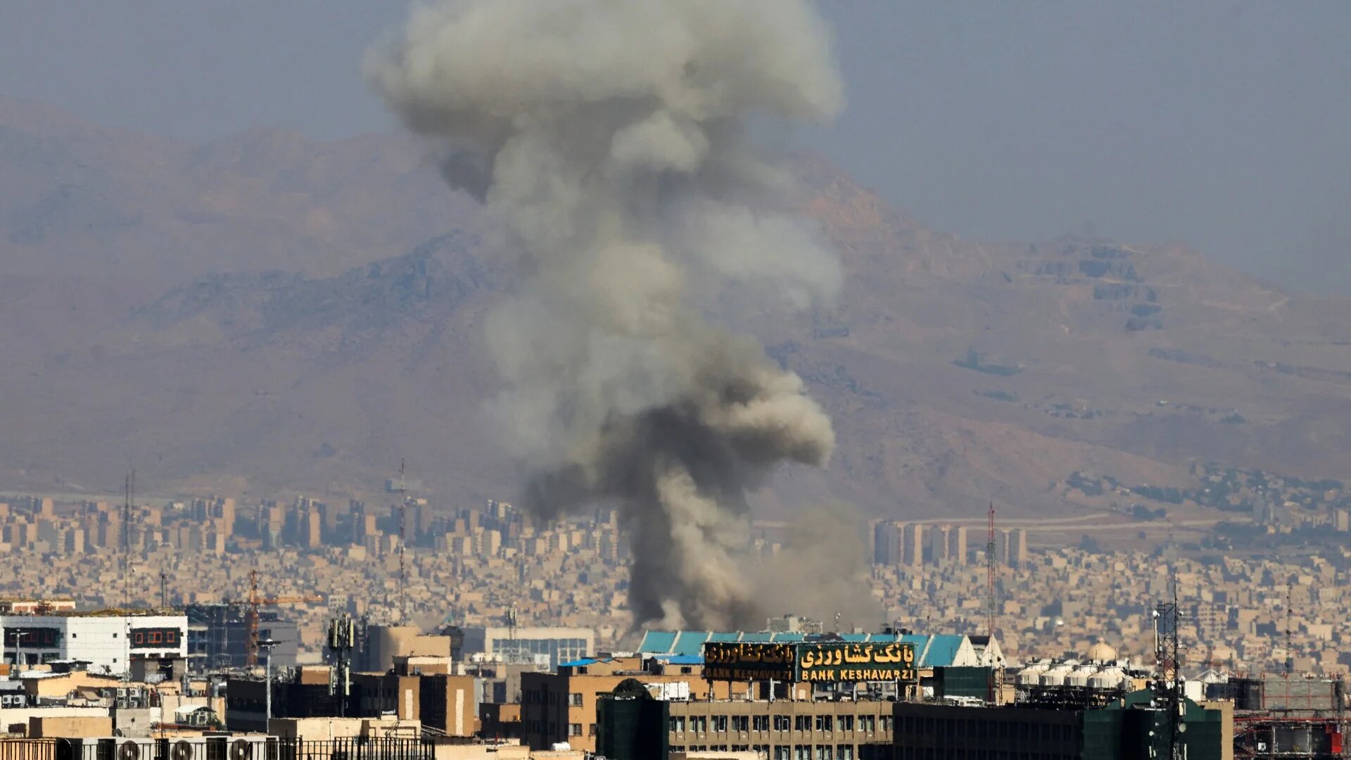 Smoke billows into the sky following an explosion in central Tehran on 15 June 2025 (Atta Kenare/AFP)