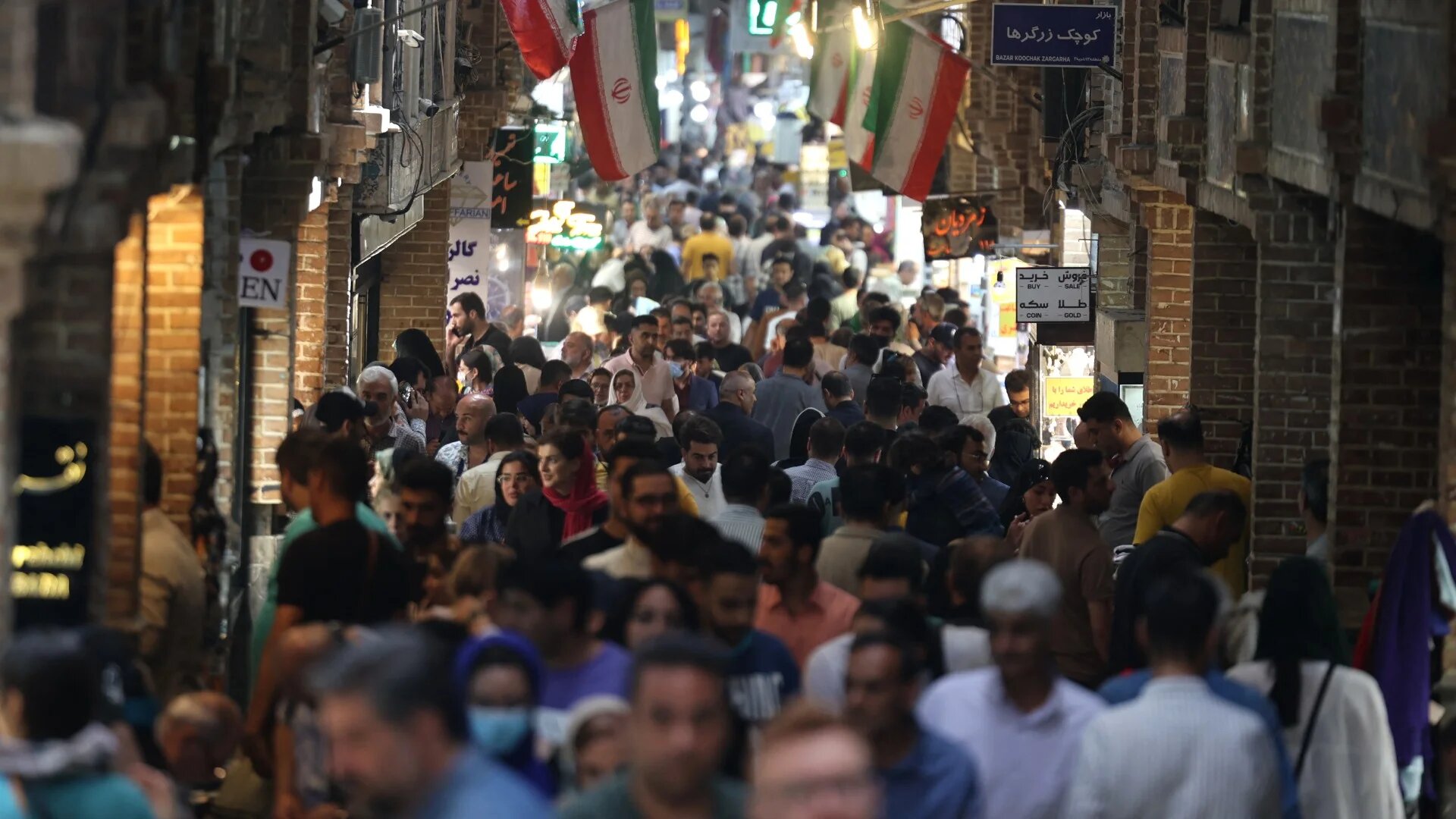 Iranians shop at the Grand Bazaar in Tehran on 22 May 2023 (AFP)