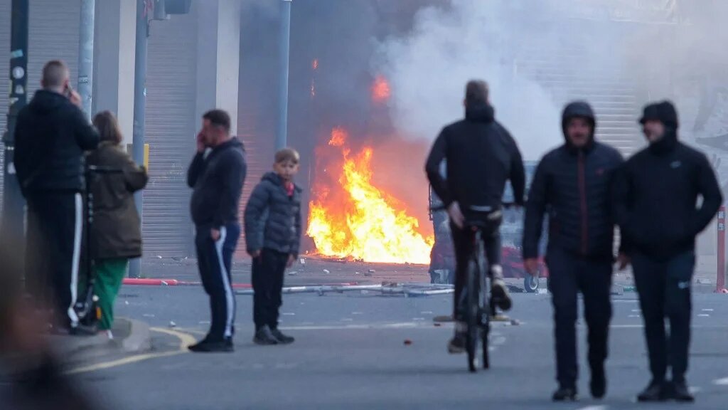 A building burns during riots in Belfast, Northern Ireland, on 9 June 2026 (Paul Faith/AFP)