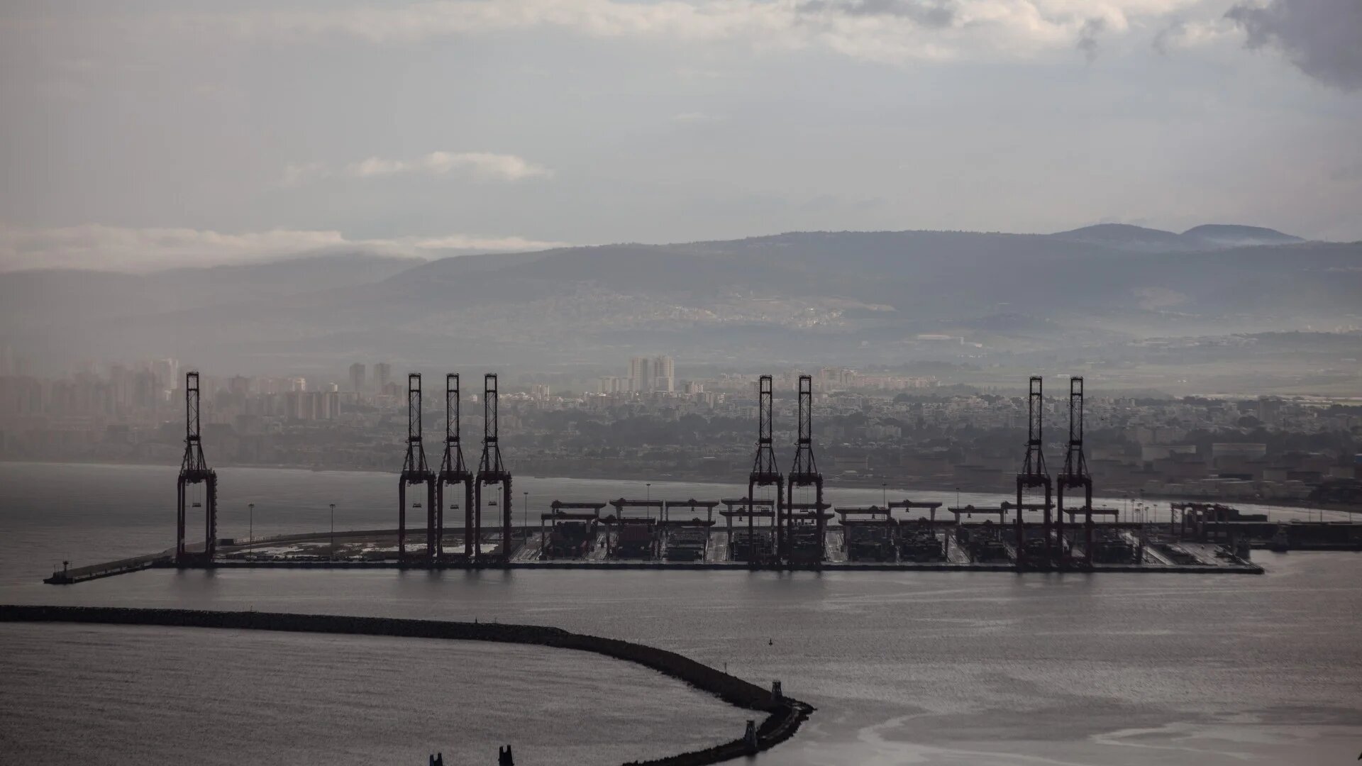 Cargo ships are seen at Israel's Haifa commercial shipping port in the Mediterranean Sea on 13 December (Reuters/Mati Milstein/NurPhoto)