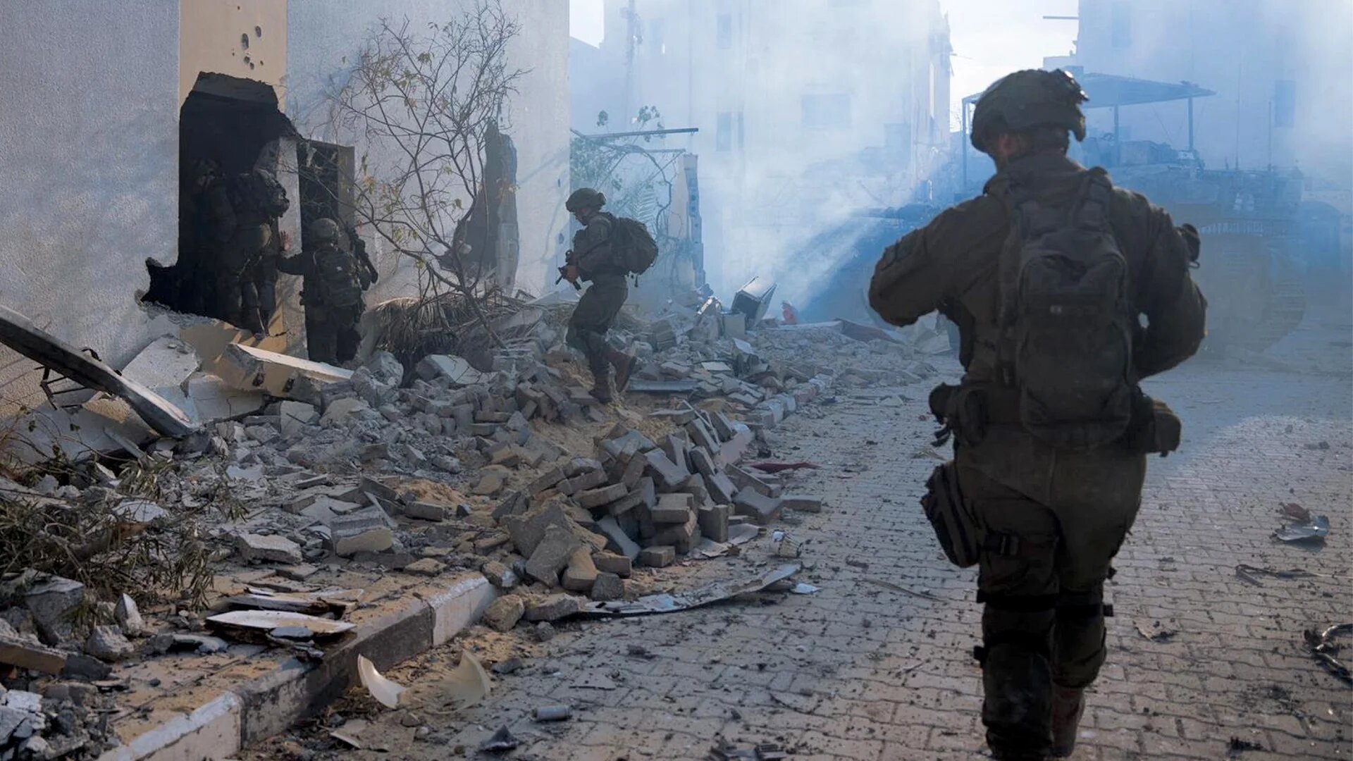 This handout picture released by the Israeli army on 23 August 2024 shows Israeli soldiers operating in the occupied Gaza Strip (AFP)