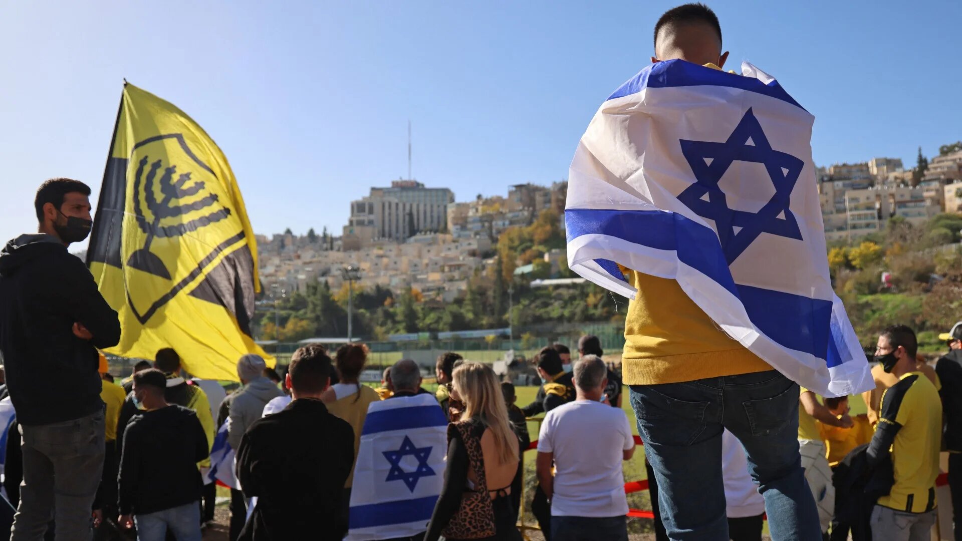 Fans of Beitar Jerusalem attend the team's training session in Jerusalem on 11 December 2020 (Emmanuel Dunand/AFP)