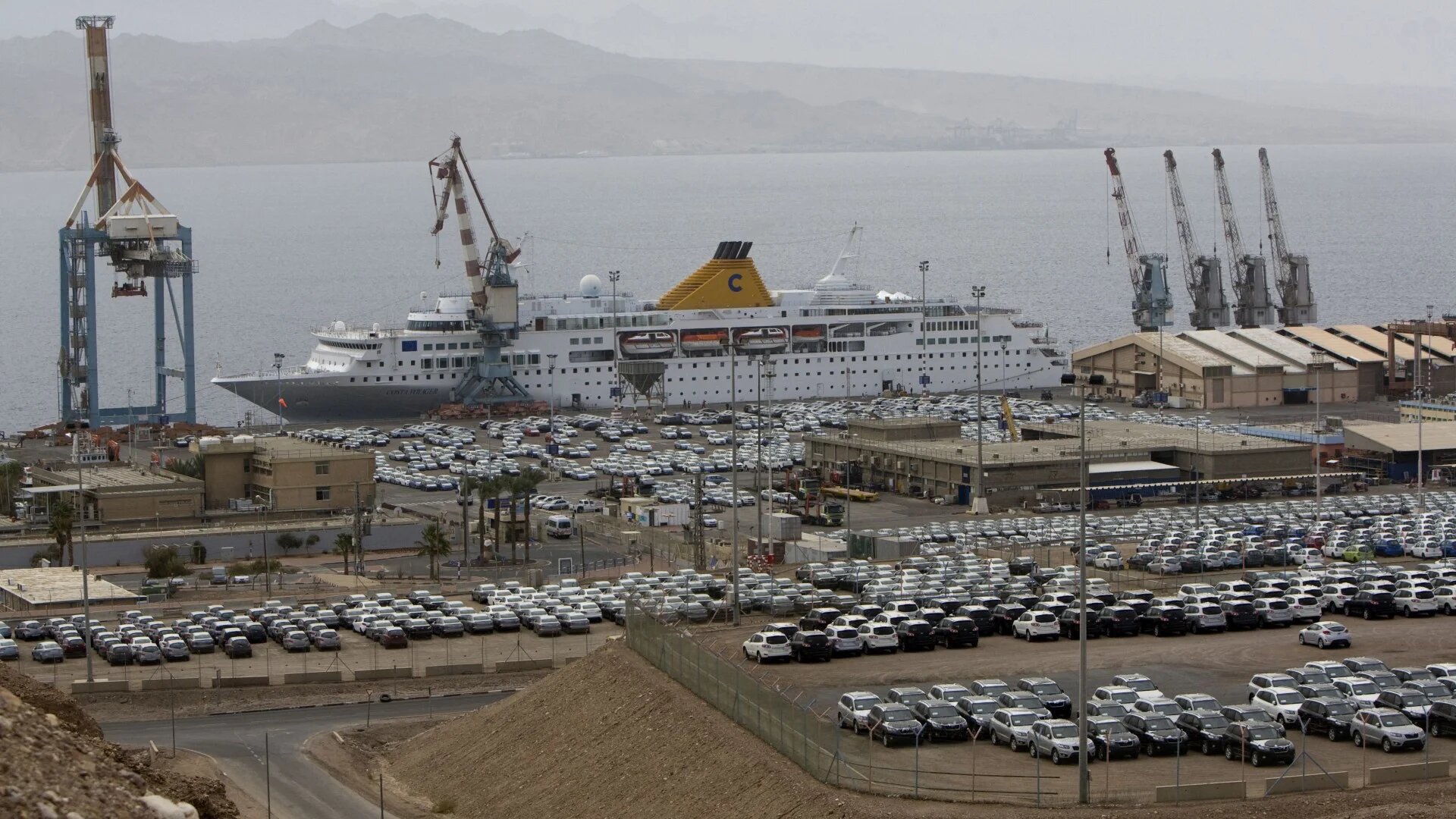 Cars are parked in the port of the southern Israeli city of Eilat, near the border with Egypt, on 15 February 2012 (Ahmad Gharabli/AFP)