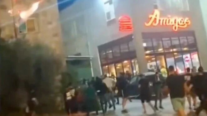 Maccabi Haifa fans can be seen storming the Amigos restaurant in Sakhnin on 8 November 2025, minutes after their match ended in a draw (Screengrab)
