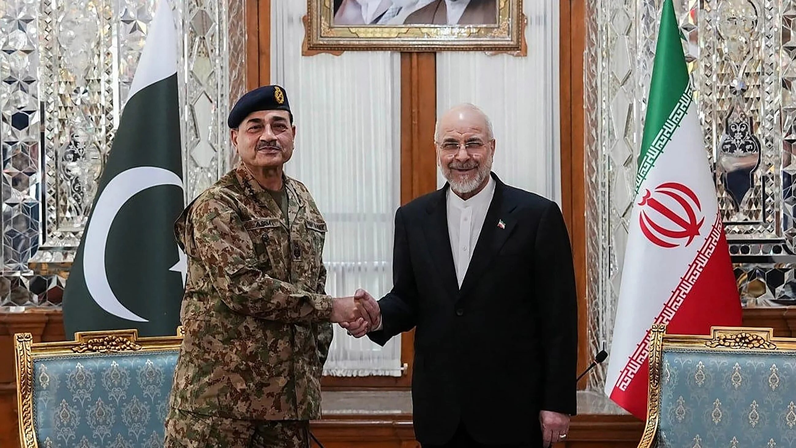 Handout photo taken shows Iranian Parliament speaker Mohammad Bagher Ghalibaf shaking hands with Pakistan's Army Chief Asim Munir before their meeting in Tehran, on 16 April, 2026 (AFP/Office of Iranian Parliament Speaker)
