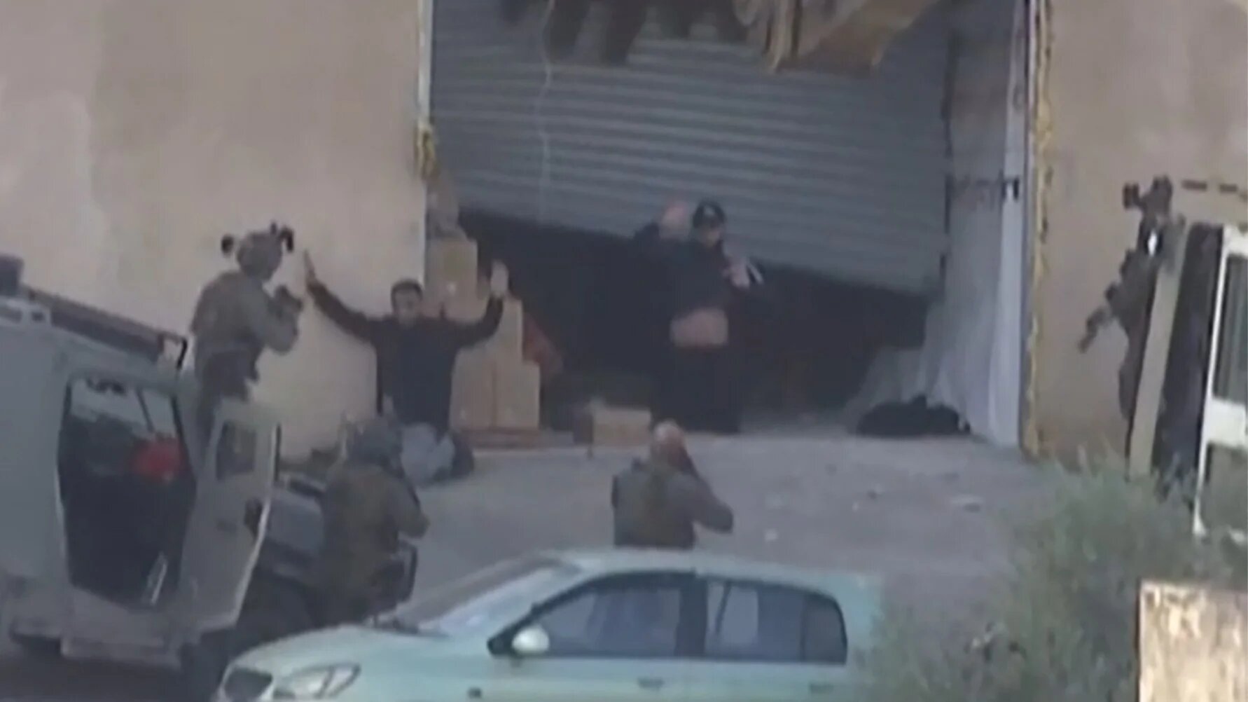 Two Palestinian men surrendering before Israeli forces, moments before being shot dead during a military operation in Jenin, West Bank 27 November 2025 (AFP/Palestine TV)