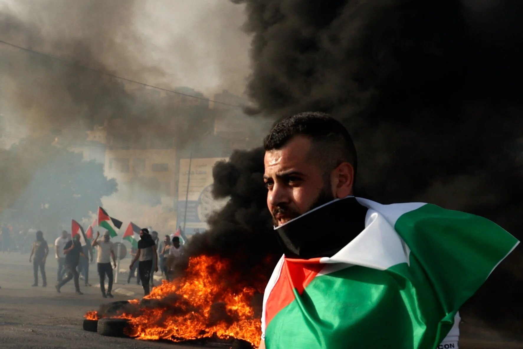A Palestinian protester at a demonstration outside the Huwara military checkpoint near Nablus in the occupied West Bank on 29 May 2022. (AFP)