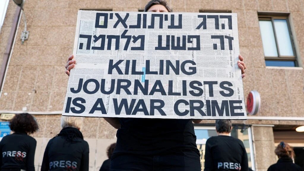 Activists protest against the killing of journalists and call for an end to the Gaza war, in Tel Aviv on 3 January 2025 (Jack Guez/AFP)