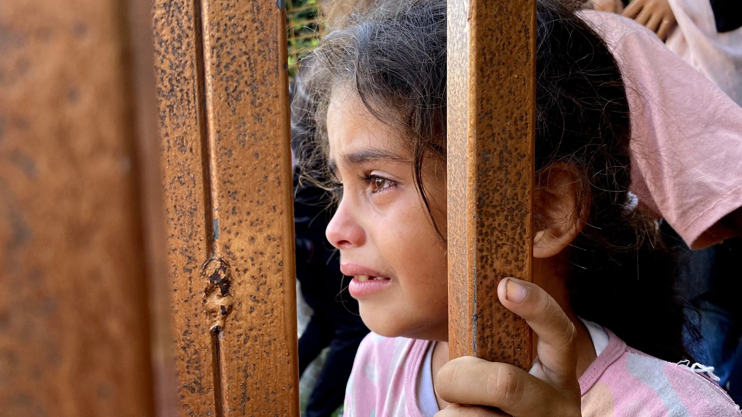 A Palestinian child cries during a funeral for victims killed by an Israeli attack on the Mawasi area of Khan Yunis, south Gaza, on 28 July 2025 (AFP)
