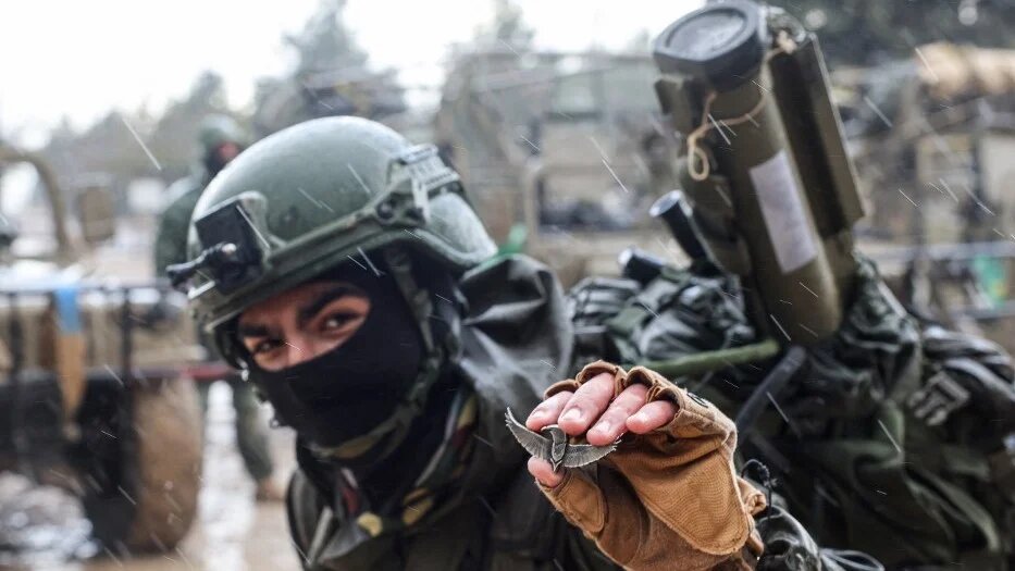 Israeli soldiers prepare to go to the Gaza Strip, near the border area in southern Israel on 13 December 2023 amid ongoing battles with Palestinian armed groups (AFP)