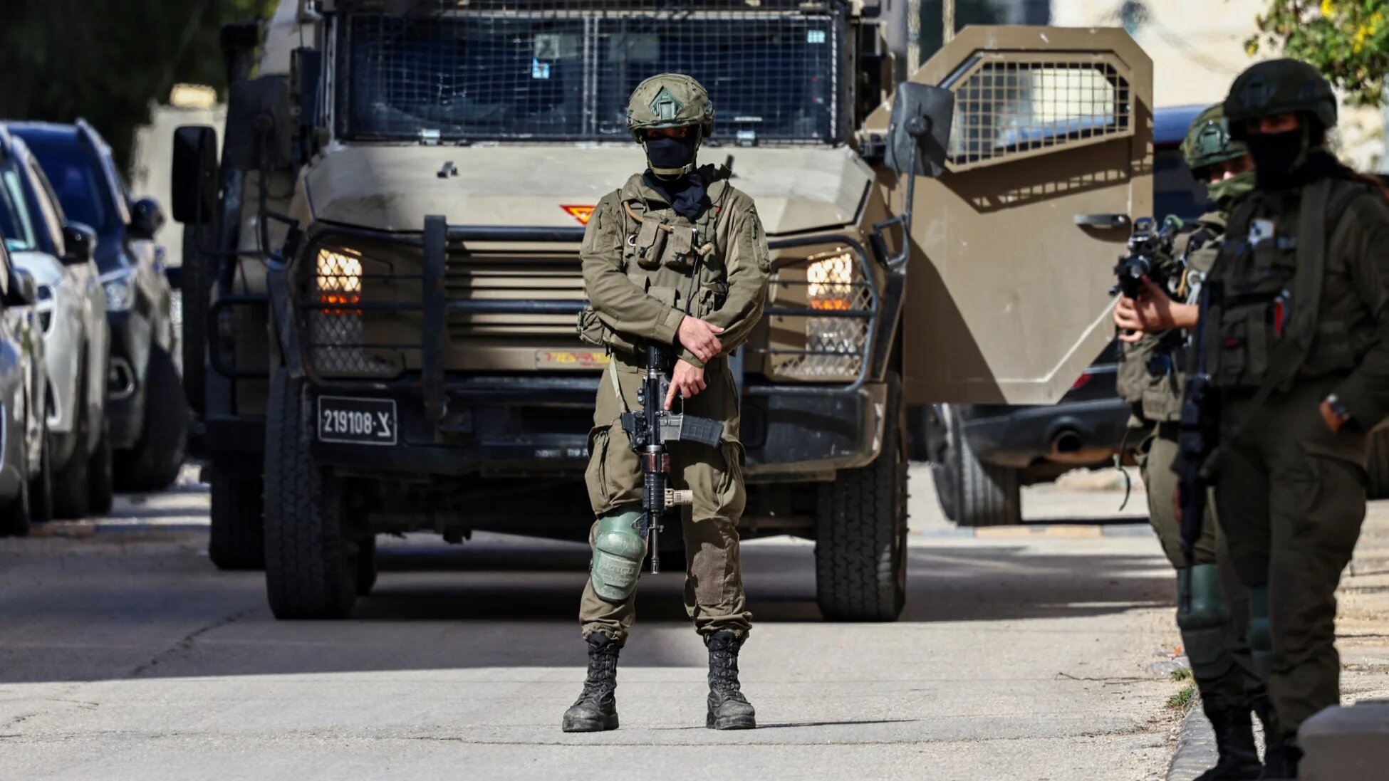 Israeli soldiers take positions during a raid in Ramallah in the occupied West Bank on 1 December 2025 (Zain Jaafar/AFP)