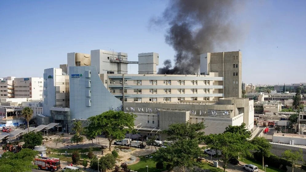 Smoke billows from a building at Soroka hospital in Beersheba, Israel, after an Iranian missile attack on 19 June 2025 (Maya Levin/AFP)