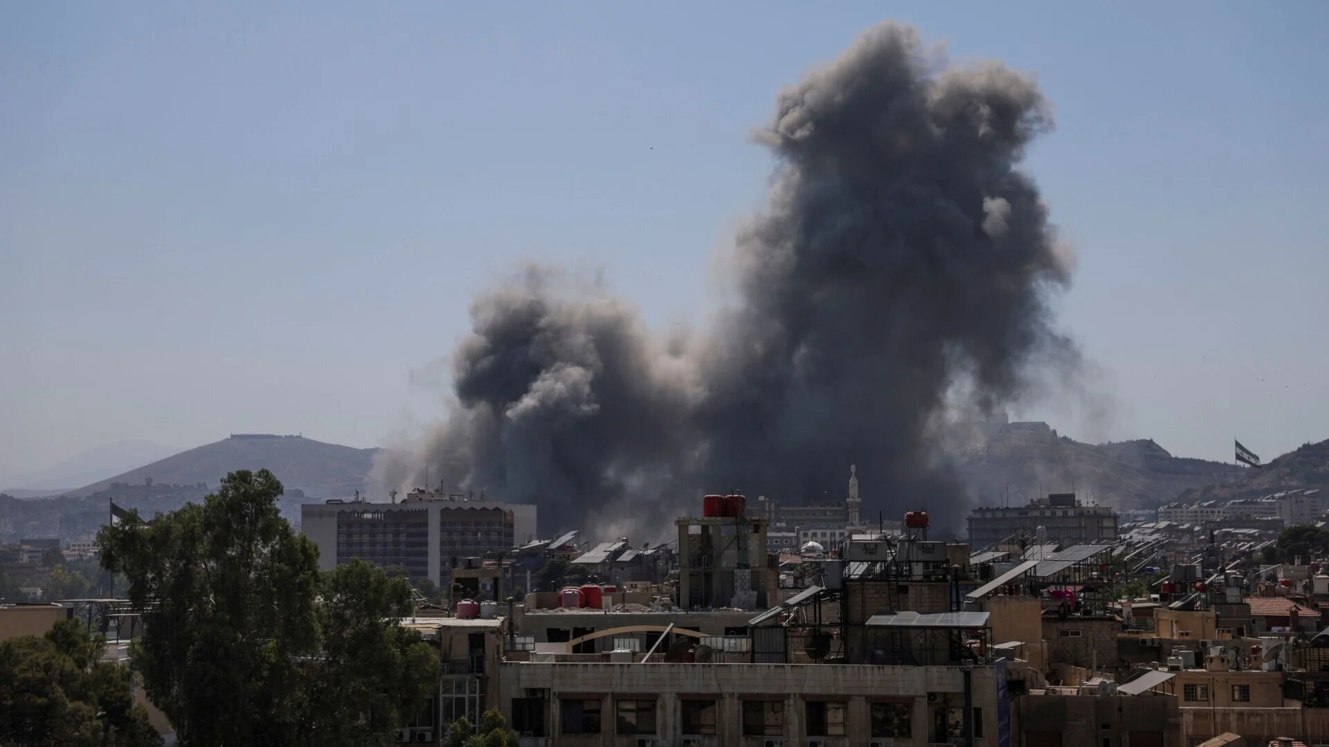 Smoke rises after Israel strikes Syria's defense ministry in Damascus on 16 July 2025 (Khalil Ashawi/Reuters)