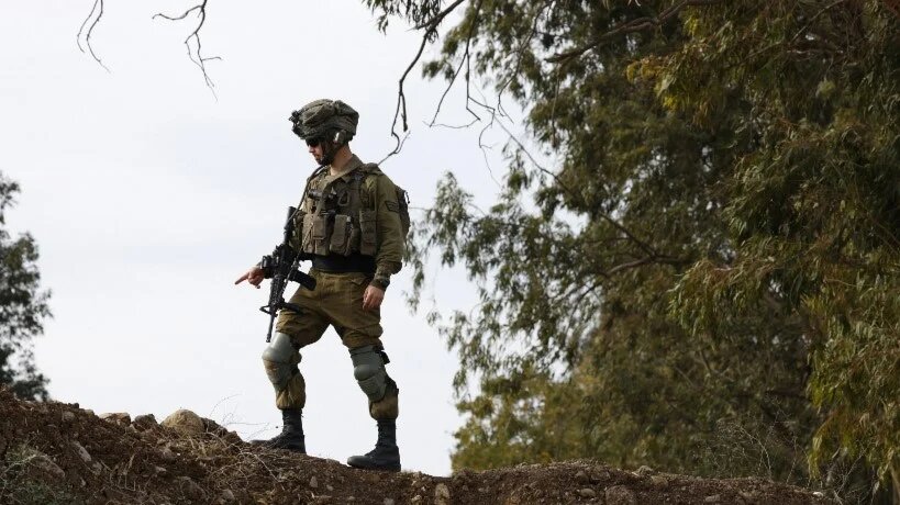 Israeli soldiers take a position in the occupied Golan Heights on 7 December 2024 (Jalaa Marey/AFP)