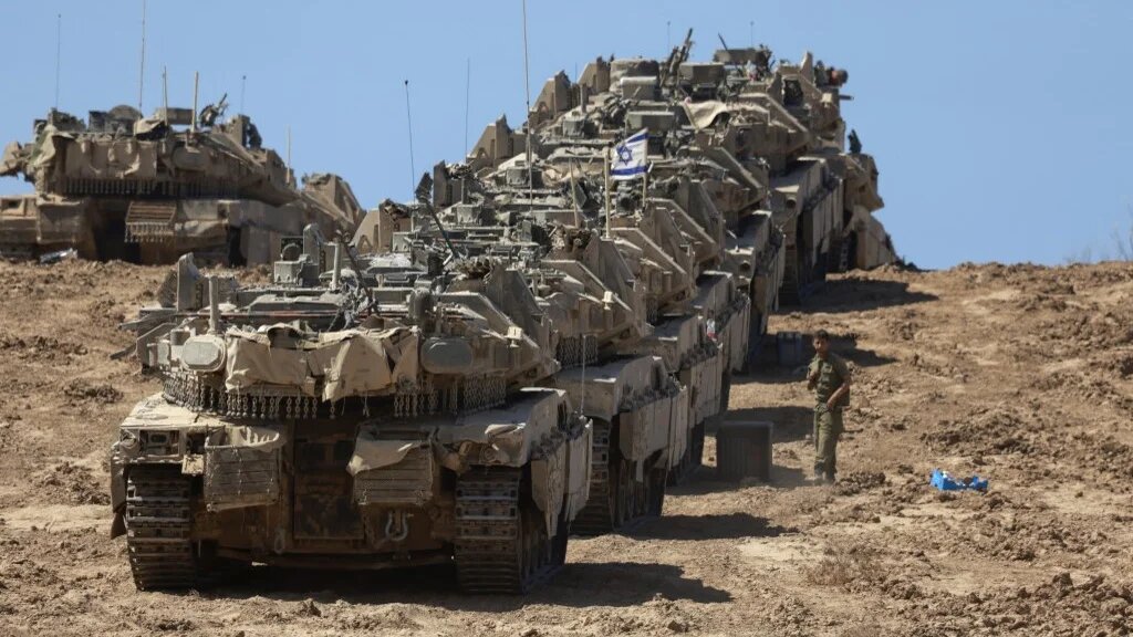A convoy of Israeli tanks is deployed near the Gaza Strip on 16 September 2025 (Menahem Kahana/AFP)