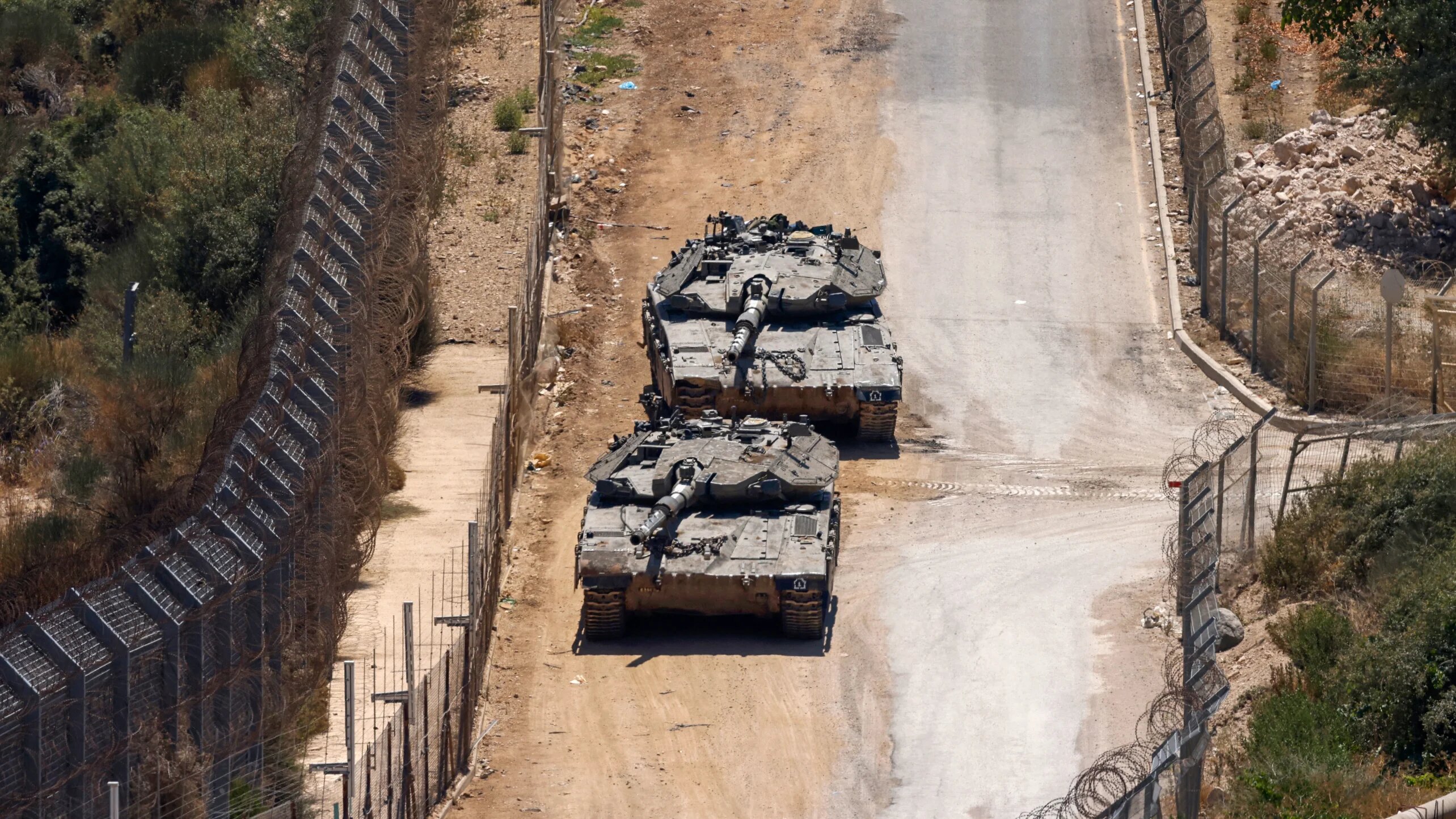 Israeli troops patrol the border fence with Syria near the Druze village of Majdal Shams in the Israeli-occupied Golan Heights on 23 July 2025 (Jalaa Marey/AFP)