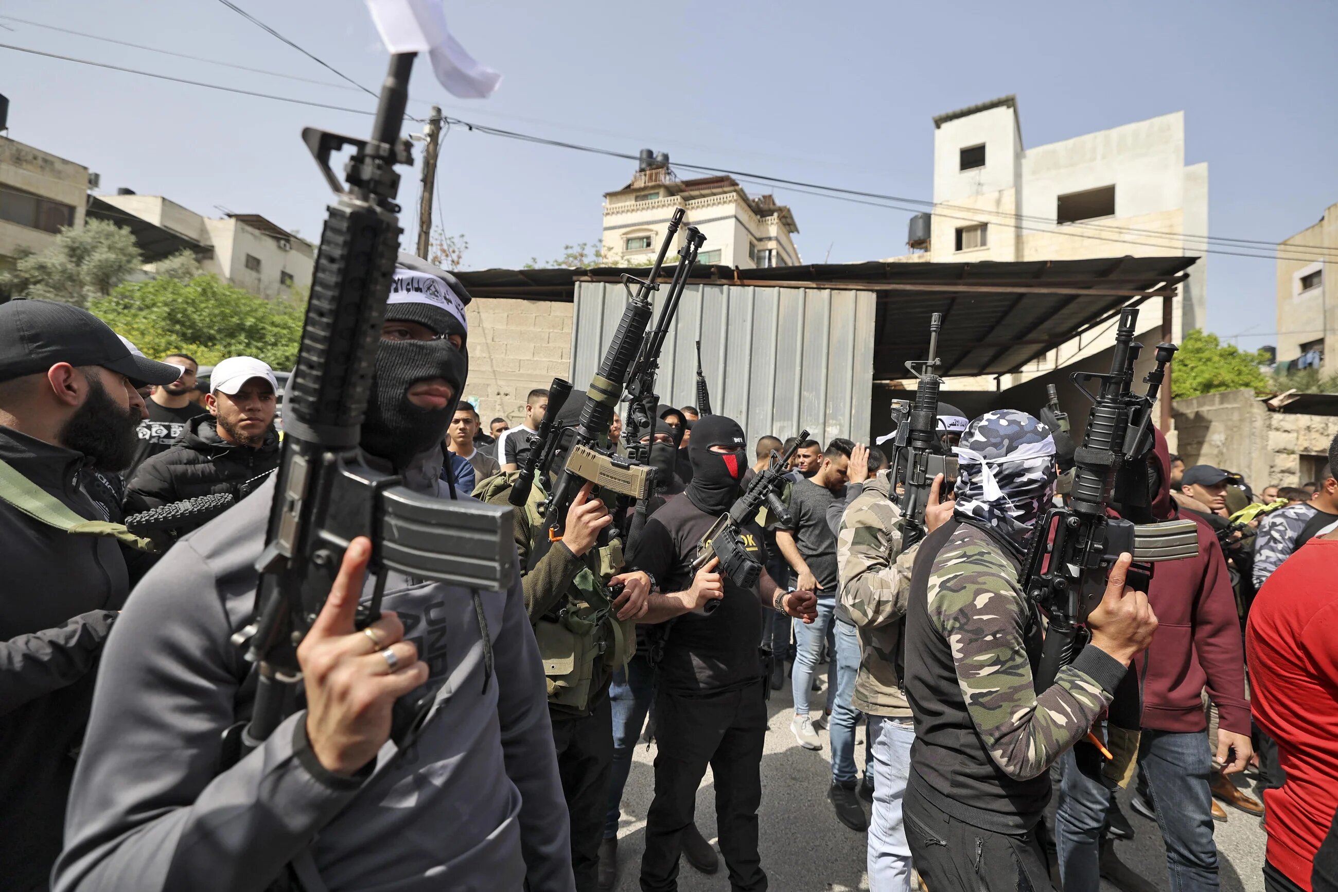 Palestinian fighters take part a funeral of Palestinian killed by Israeli soldiers in Jenin on 11 April 2022. (Afp)