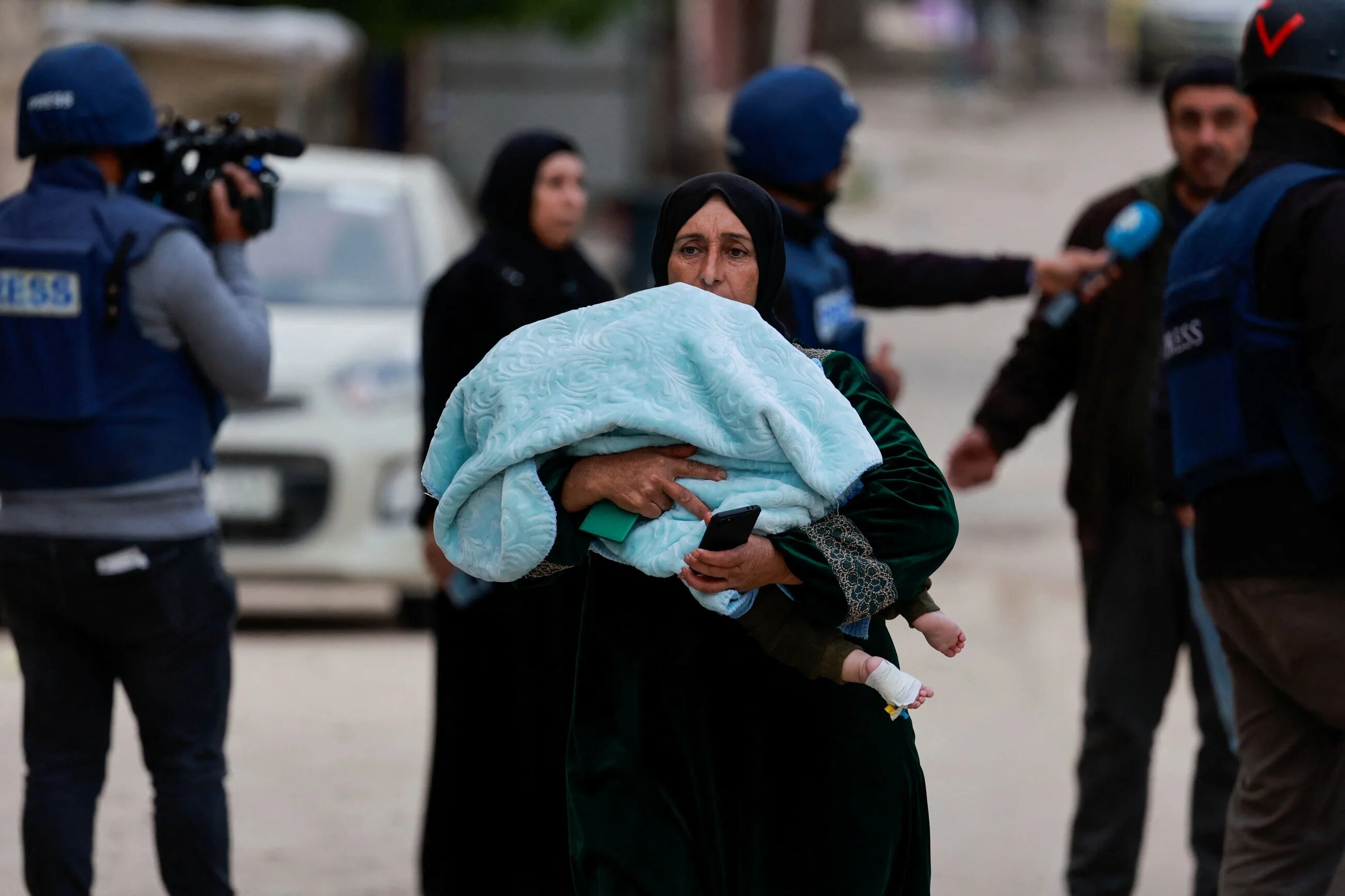Palestinians leave the Jenin camp, in the occupied West Bank, during an Israeli incursion on 22 January 2025 (Reuters/Ammar Awad)