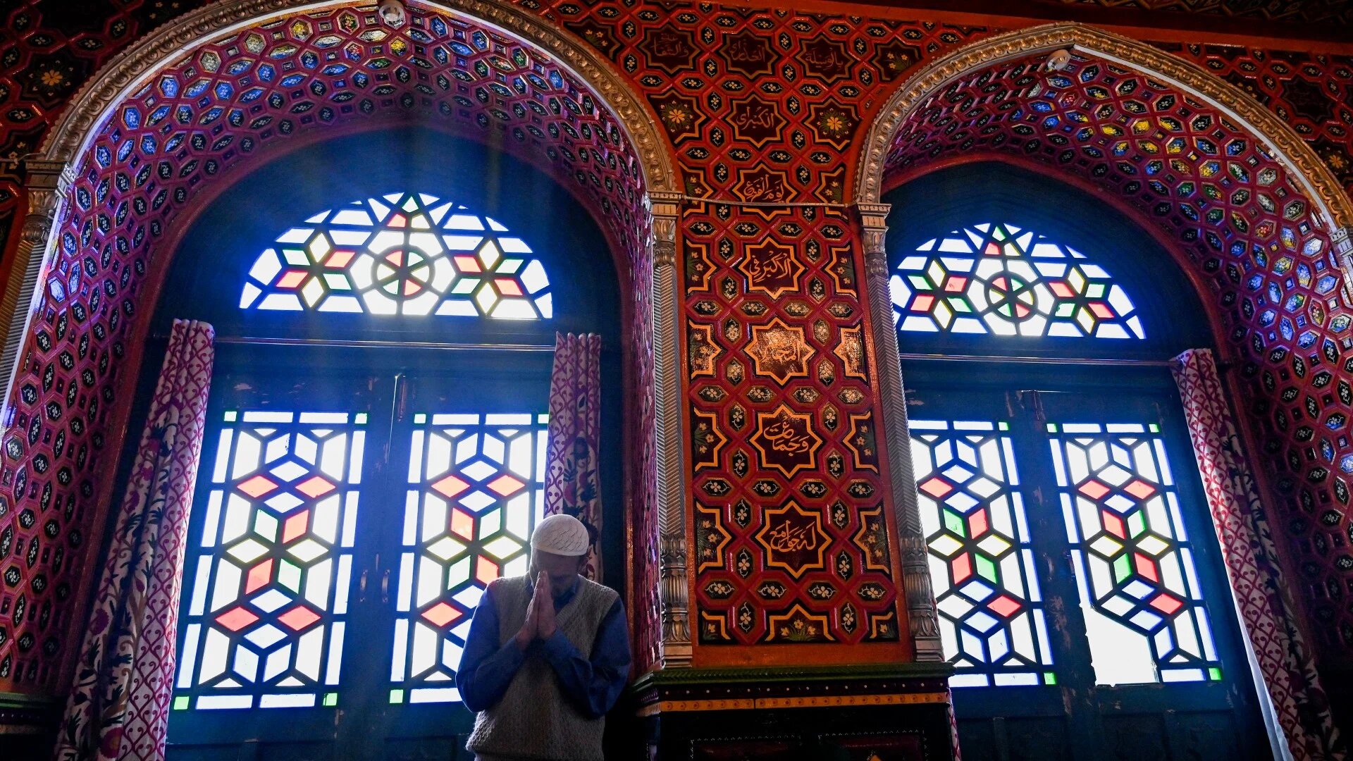 A Muslim devotee offers Friday prayers inside the Sheikh Abdul Qadir Jilani shrine during the holy fasting month of Ramadan in Srinagar on 22 April, 2022 (AFP)