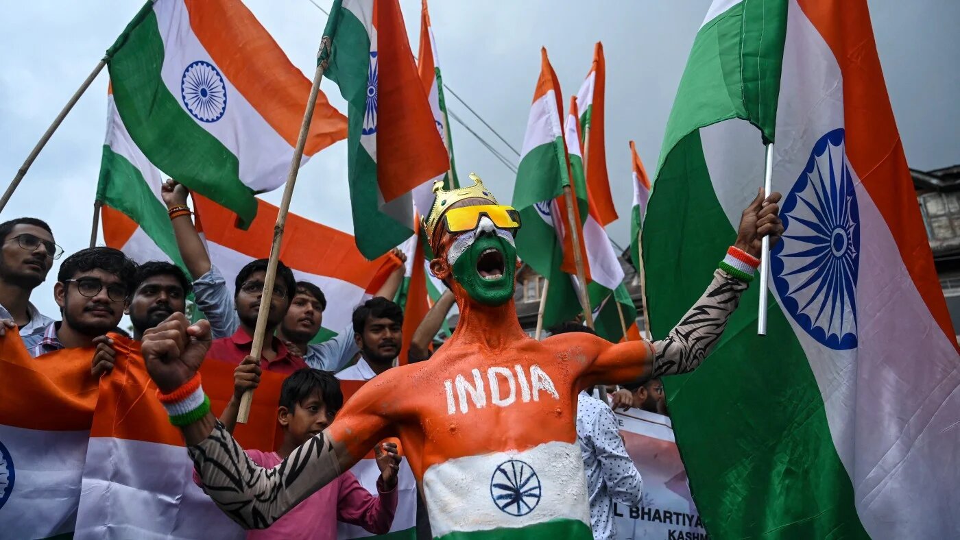An Indian activist in Srinagar on 15 August 2022 (AFP)