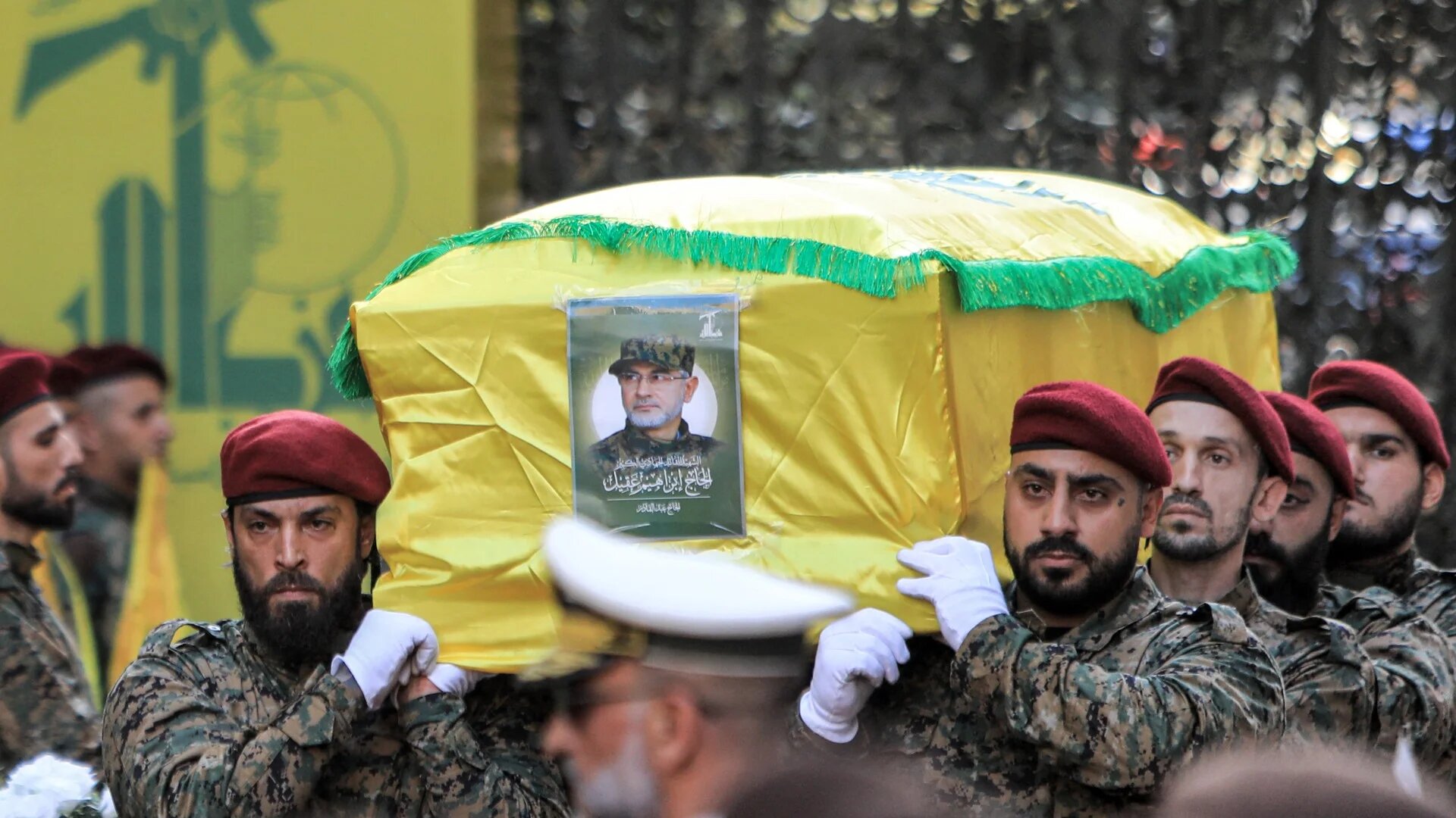 Hezbollah fighters carry the body of the group's top military commander Ibrahim Aqil during his funeral in Beirut's southern suburbs on 22 September 2024 (AFP)
