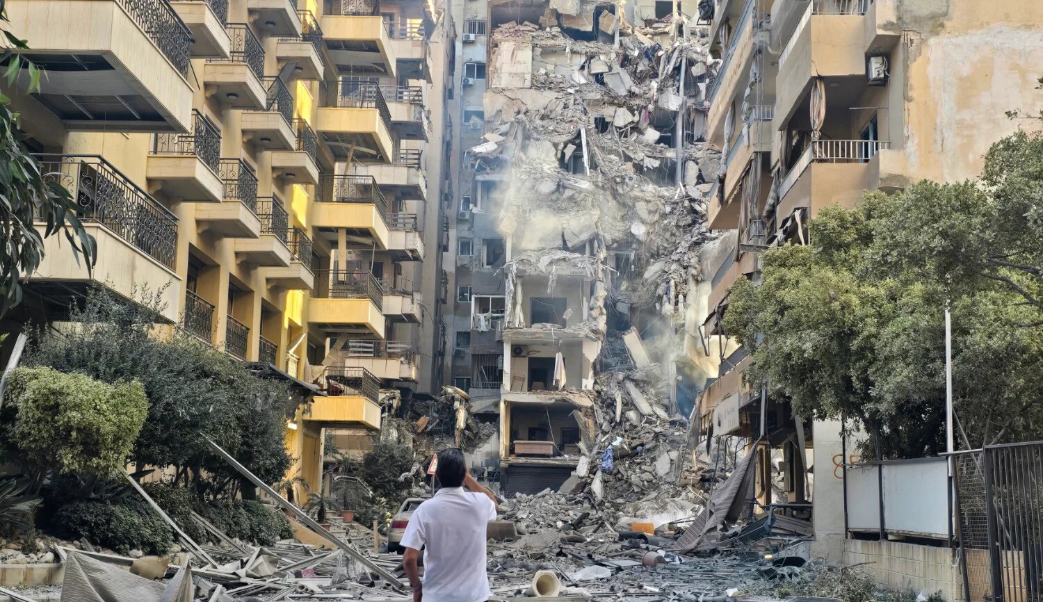 A man looks at the destruction at the site of an Israeli strike in Sour, southern Lebanon, on 28 May 2026 (Kawnat Haju/AFP)