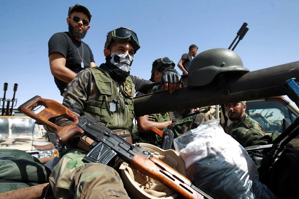 Members of Khalifa Haftar's self-proclaimed Libyan National Army gather in the city of Benghazi, on their way to Sirte