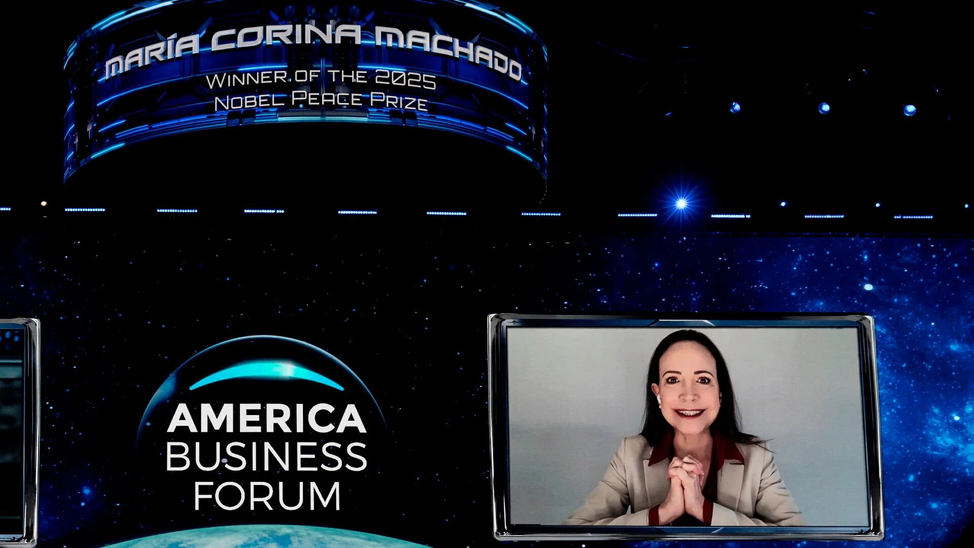 Venezuelan opposition leader and 2025 Nobel Peace Prize winner Maria Corina Machado appears via video conference at the America Business Forum in Miami, Florida, on 5 November 2025 (Marco Bello/Reuters)