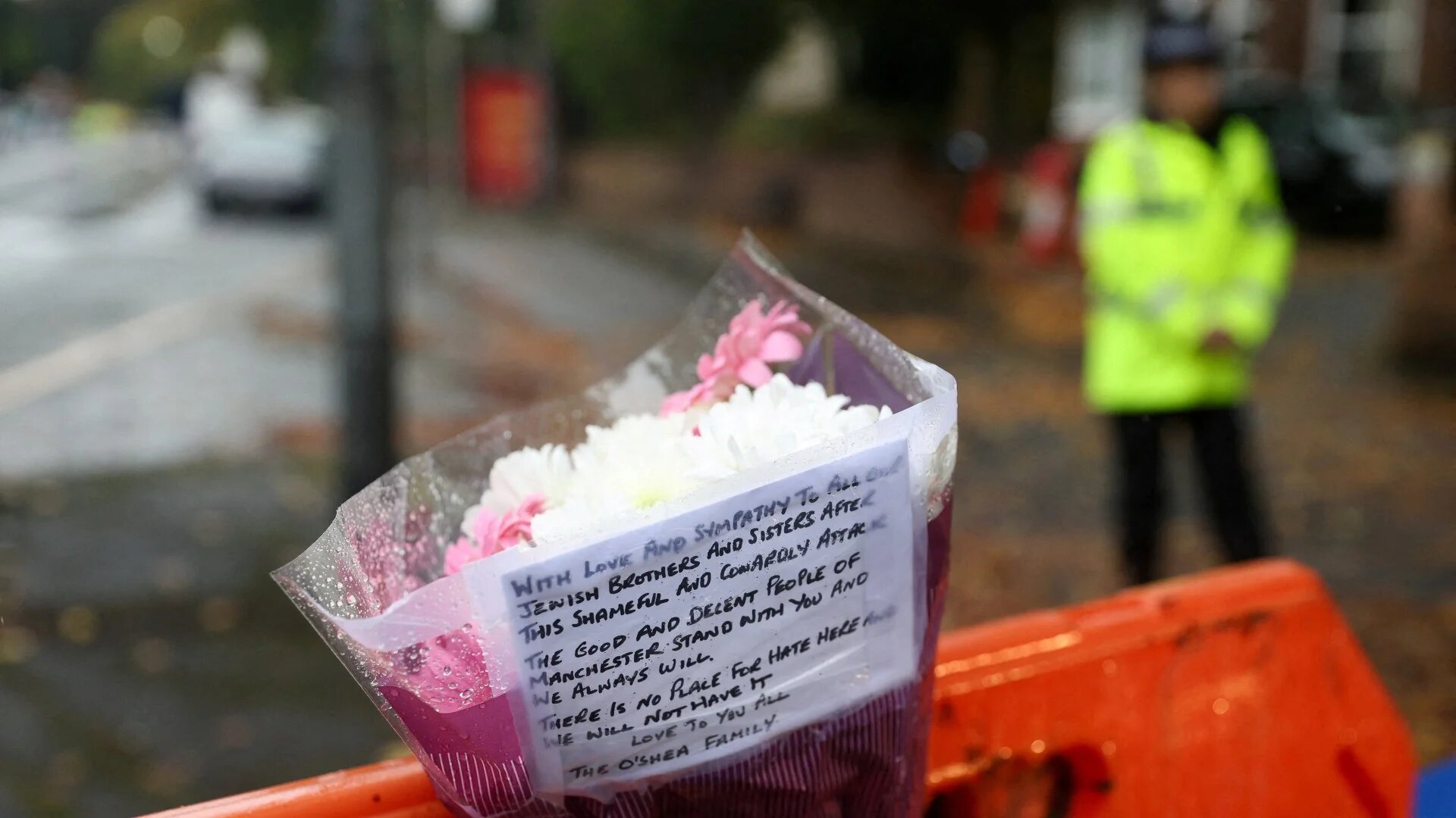 A floral tribute is left outside the Manchester synagogue in north Manchester, 3 October 2025 (Reuters/Temilade Adelaja)