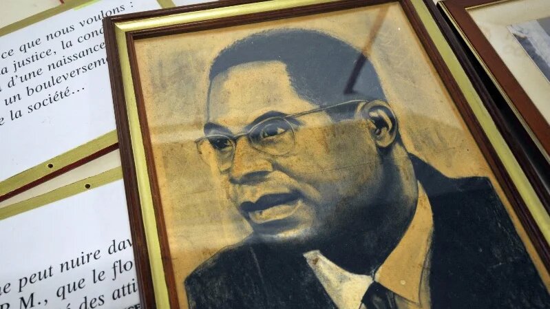 A portrait of Aime Cesaire, a Martinique-born poet and politician, lies on a table in the island’s capital, Fort-de-France, on 15 April 2008 (Franck Fife/AFP)